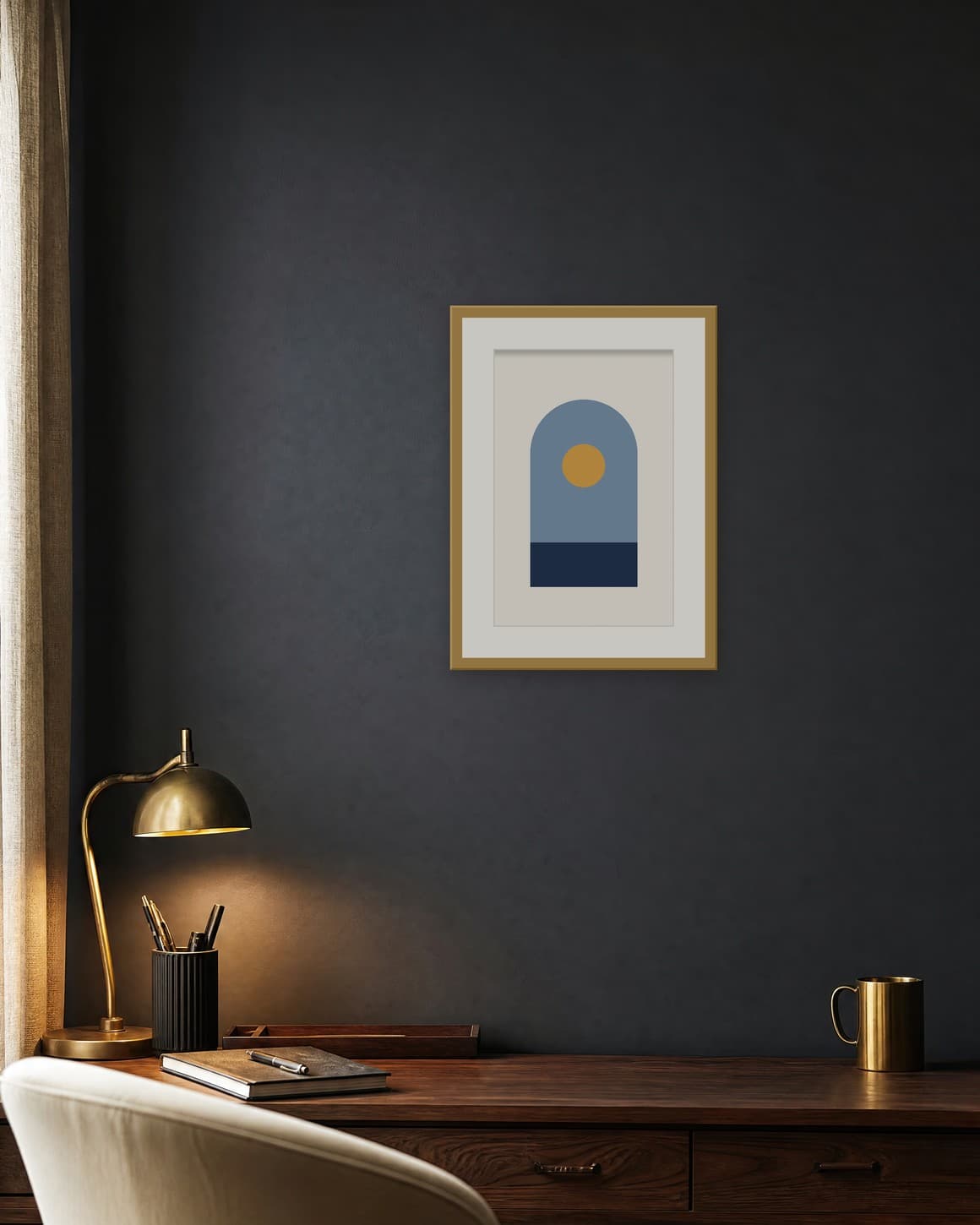 Navy and gold arch poster with a pale mat in a brass frame on a charcoal office wall above a walnut desk