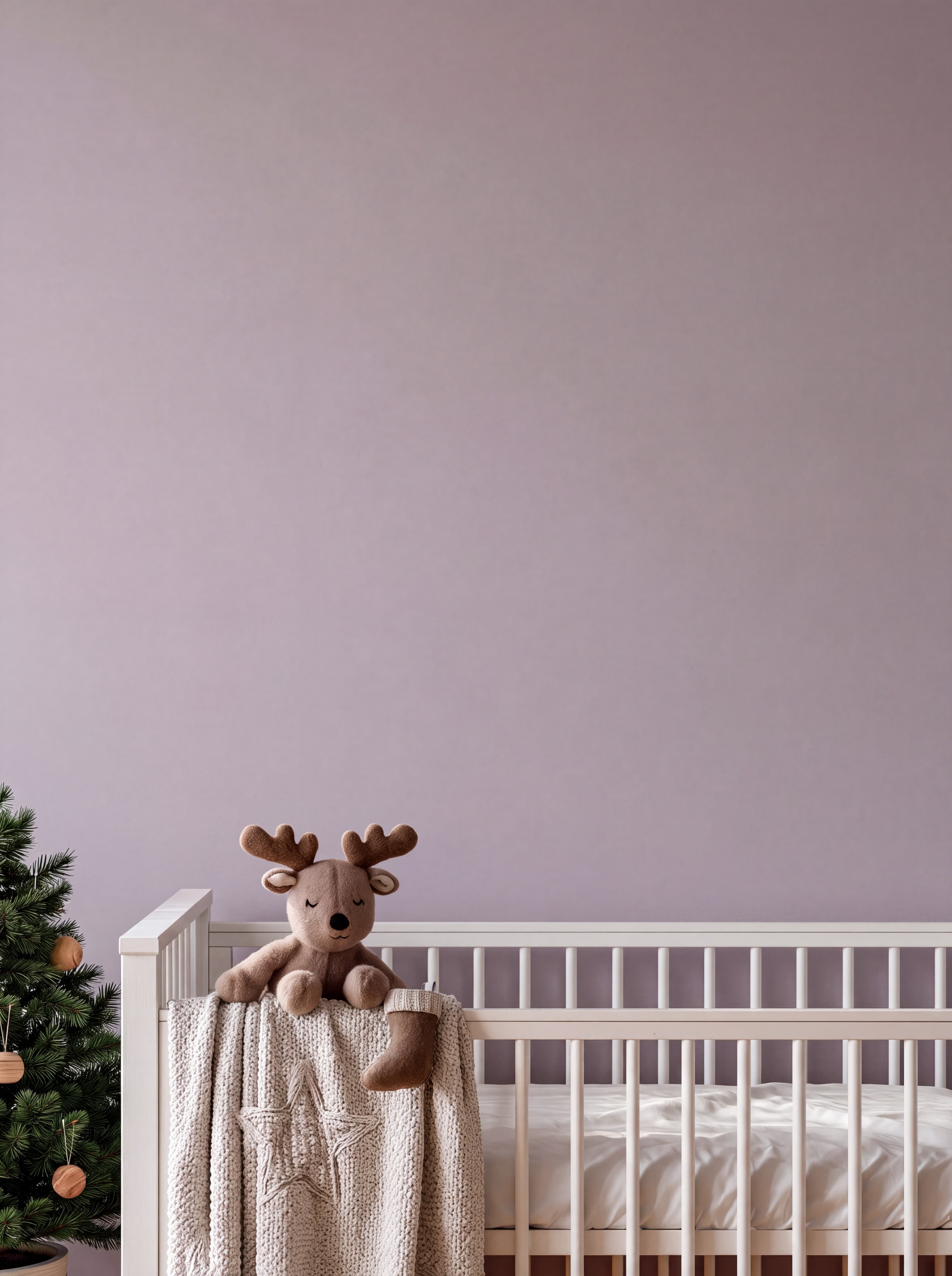 Baby's first Christmas nursery with a soft lavender wall, white crib, knit blanket, and plush reindeer, ranked 10 among christmas mockups