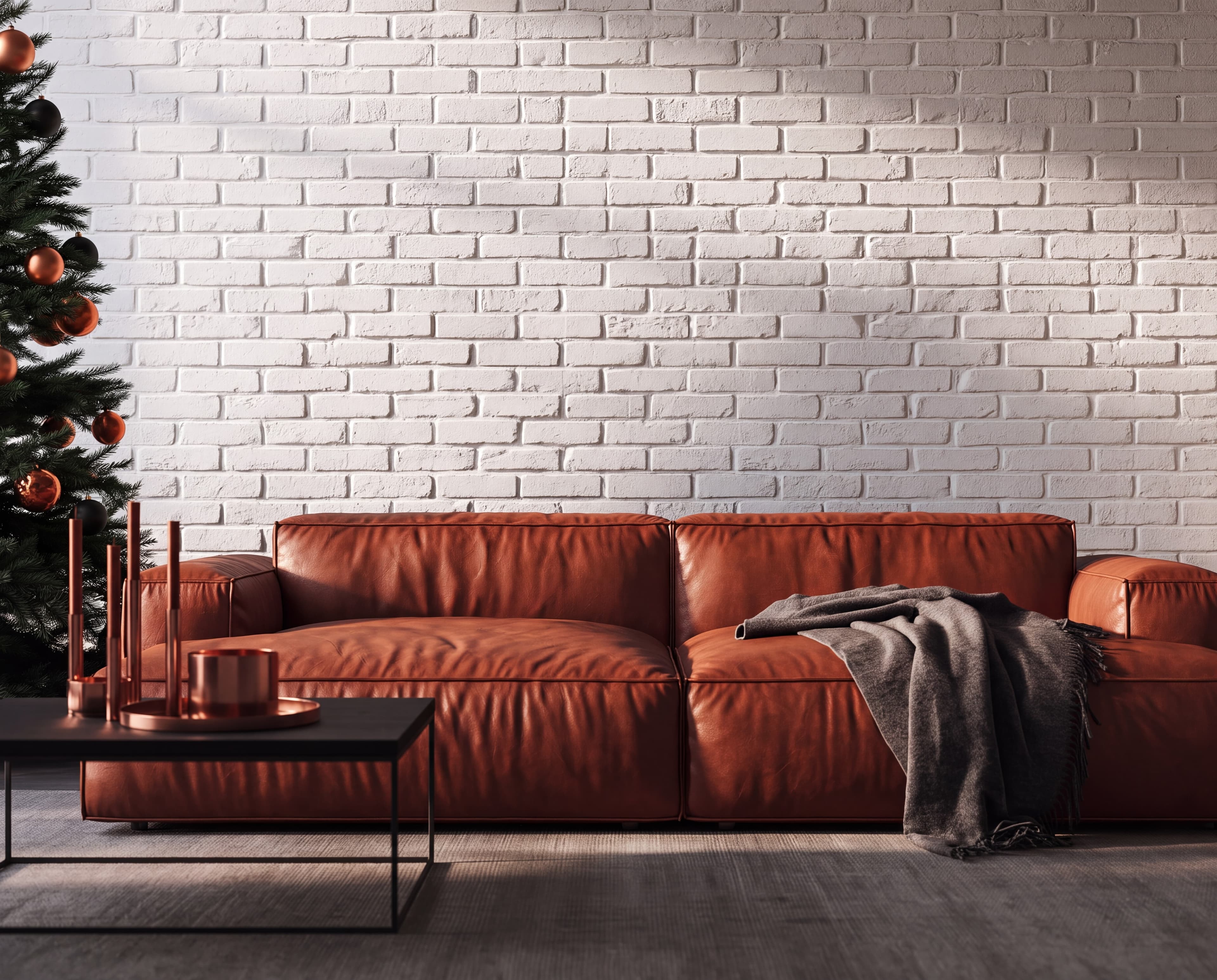 Industrial Christmas loft with a whitewashed brick wall, cognac leather sofa, copper candles, and copper ornament tree, ranked 7 among christmas mockups