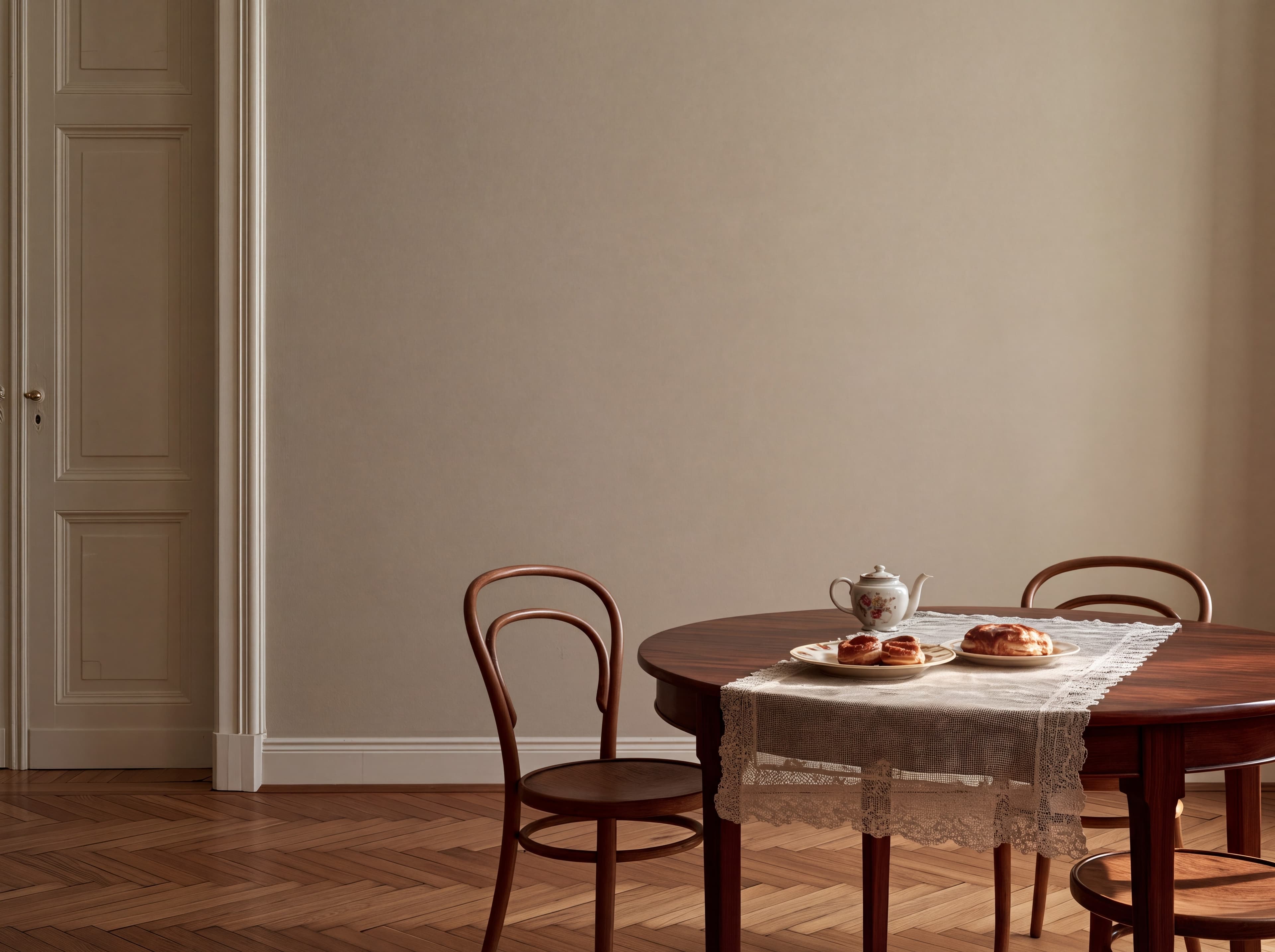 Budapest apartment dining room with a warm taupe wall, panelled double door, lace runner, pastries, and bentwood chairs, ranked 19 among landscape poster mockups