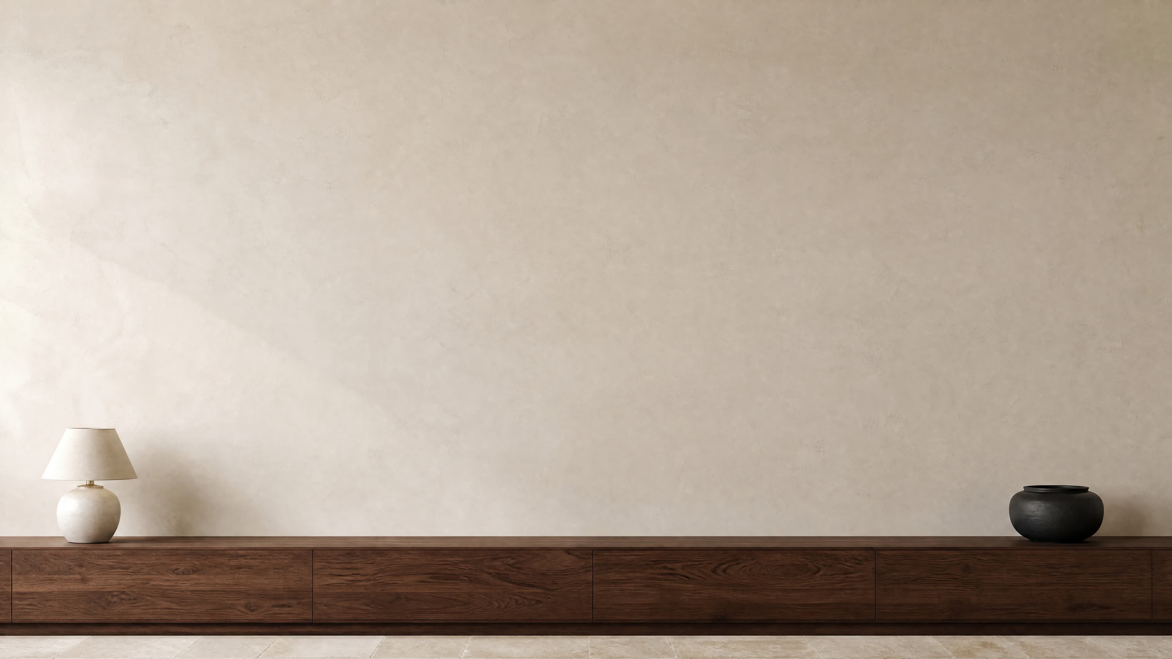 Refined minimalist interior with a vast beige plaster wall above a low continuous walnut console, ranked 14 among exhibition mockups