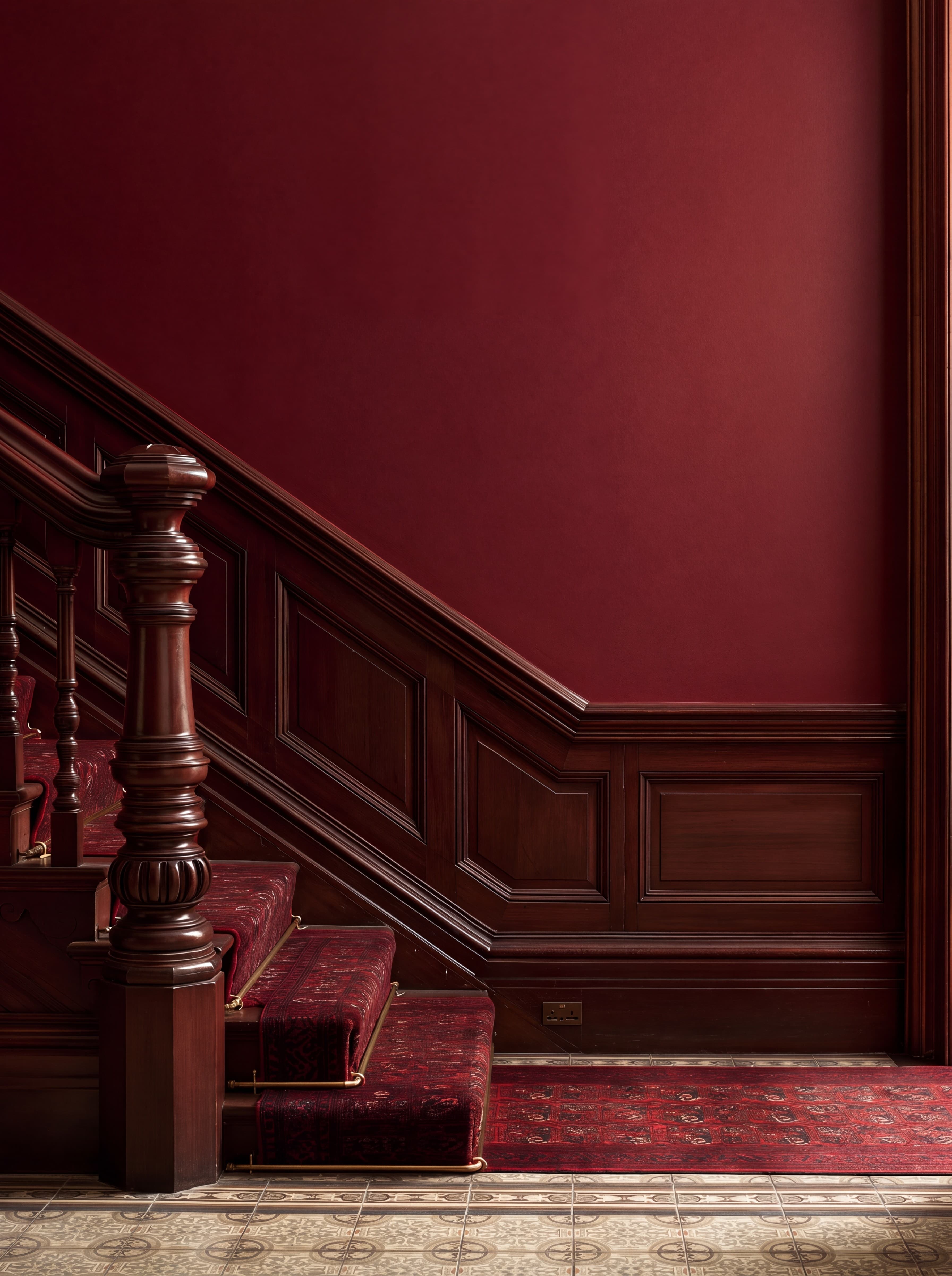 Victorian staircase hall with a deep claret wall, carved mahogany banister and newel post, and a patterned stair runner, ranked 11 among 11x17 poster mockups