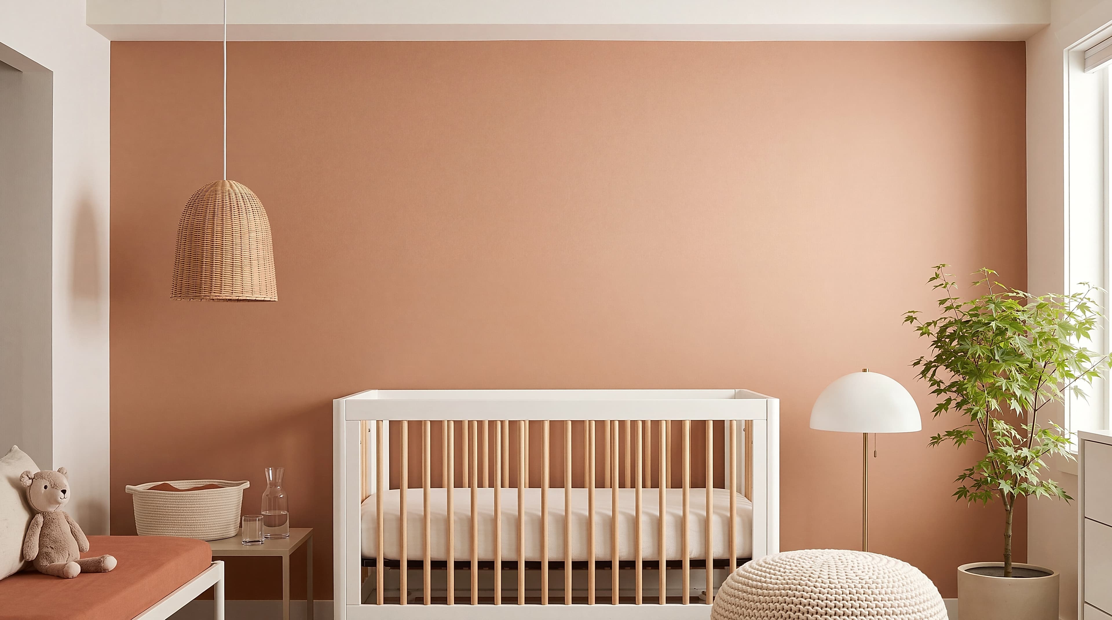 Scandinavian Kids with white lacquered crib with light natural oak vertical spindles and spherical cream wool knitted pouf ottoman, ranked 18 among nursery mockups