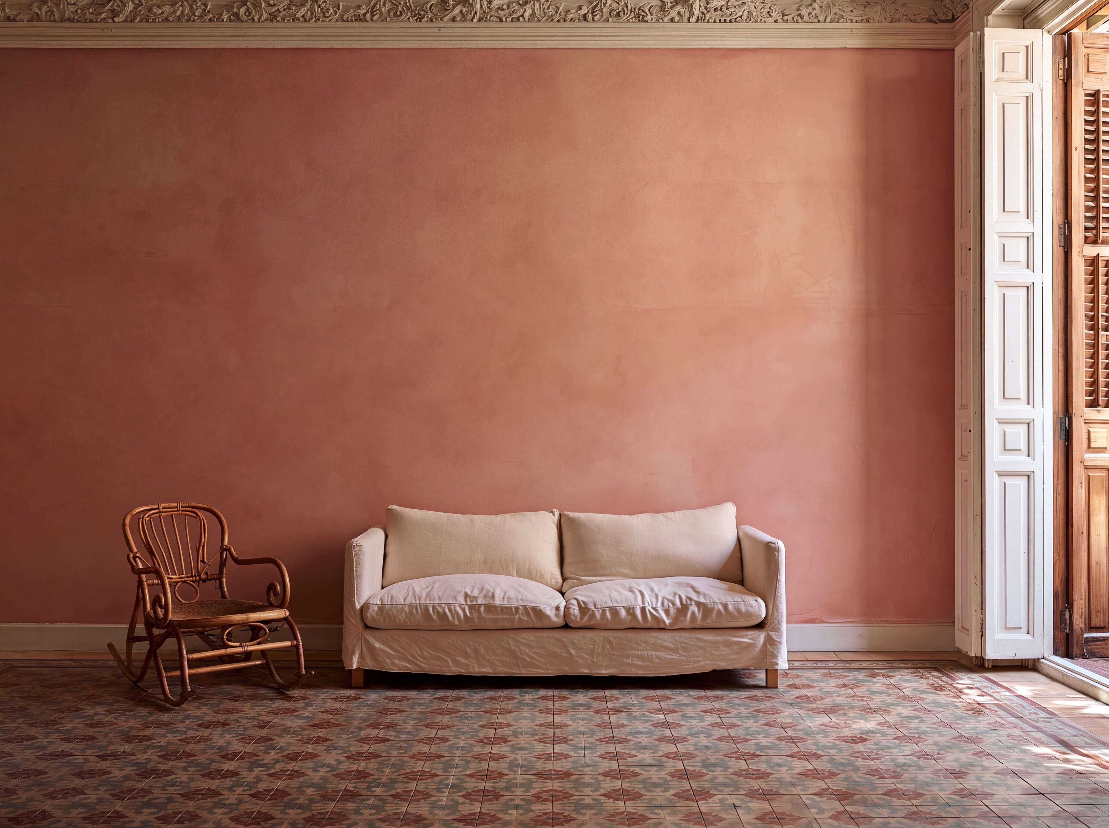 Madrid apartment living room with a salmon pink plaster wall, linen sofa, bentwood rocking chair, and hydraulic tile floor, ranked 15 among european room mockups
