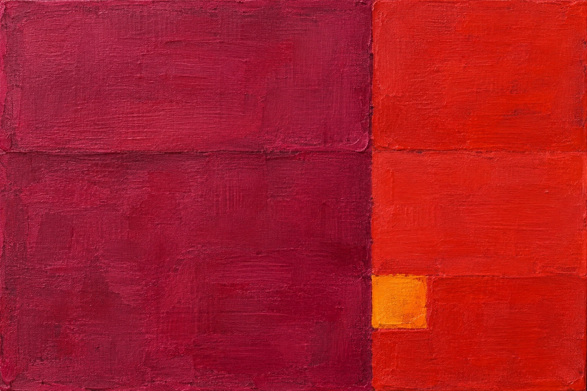 Tight overhead crop of an analogous magenta, red, and warm yellow acrylic block composition with a clear 60 30 10 balance