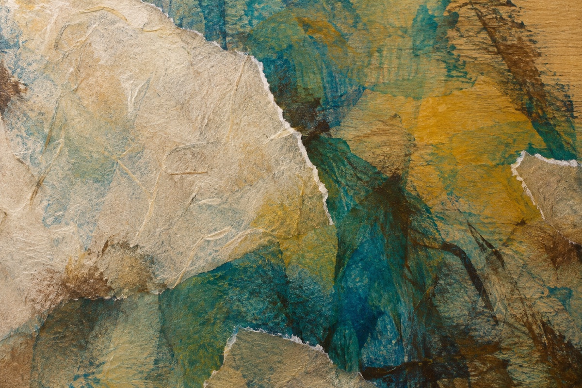 Tight overhead crop of a mixed-media abstract with torn-paper seams partly buried under blue-green and transparent gold veils