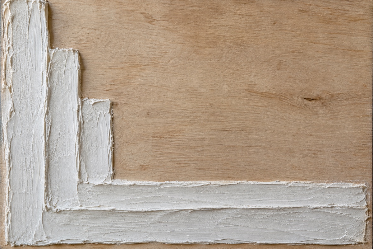 Close process crop of fully dry shallow modeling-paste ridges on a square panel before sanding and staining