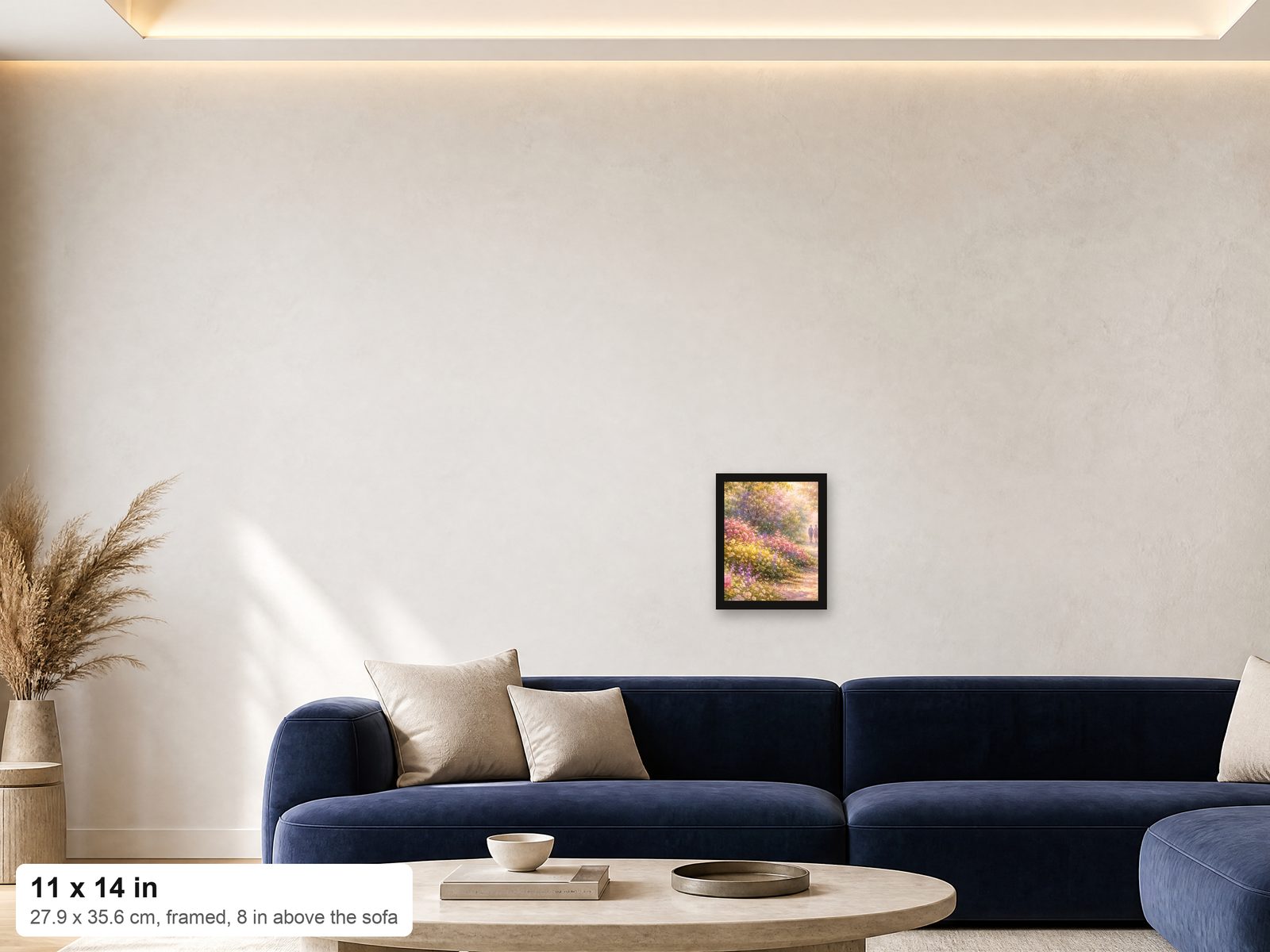 An 11x14 framed print shown at true scale on a wall above a navy sofa