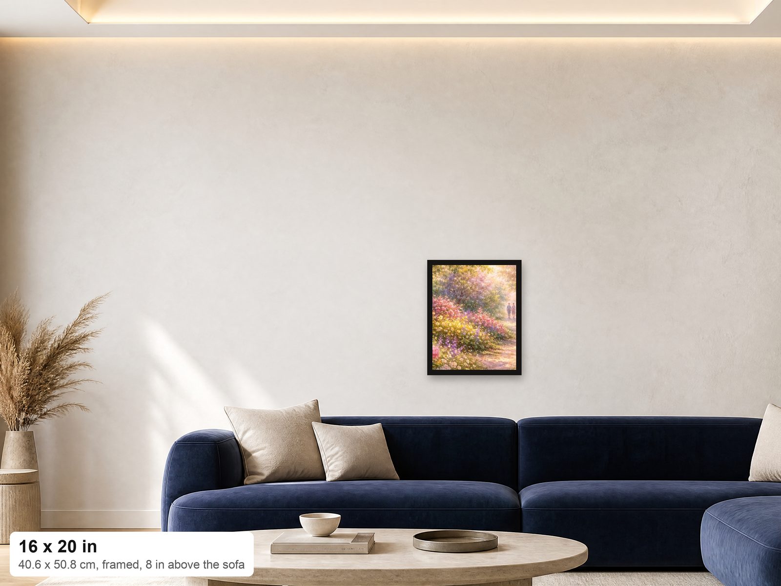 A 16x20 framed print shown at true scale on a wall above a navy sofa