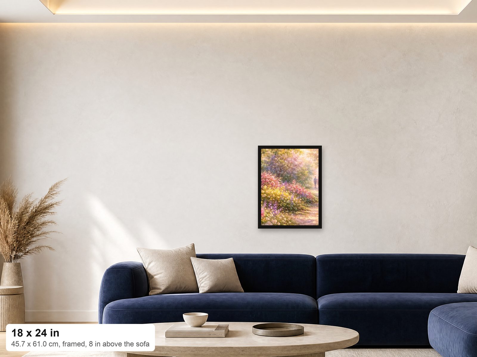 An 18x24 framed print shown at true scale on a wall above a navy sofa