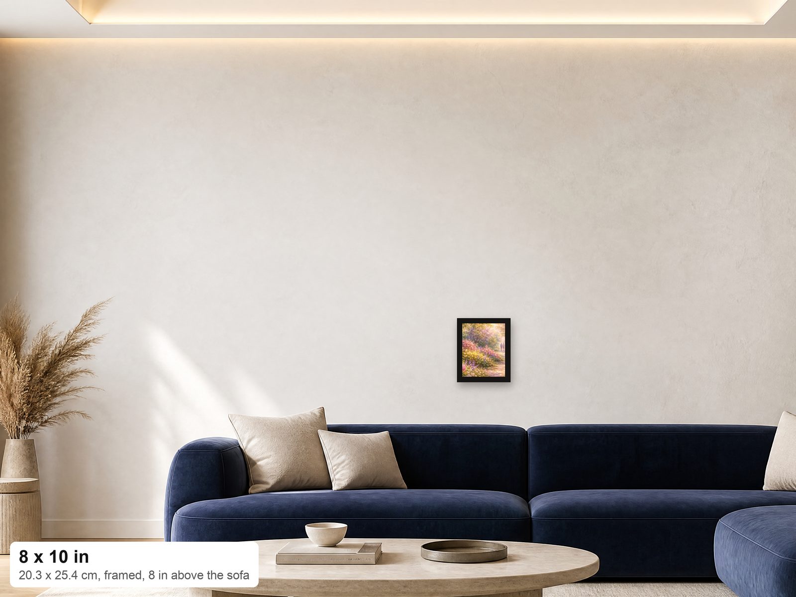 An 8x10 framed print shown at true scale on a wall above a navy sofa