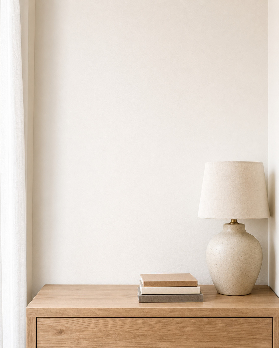 Compact warm-white bedroom nightstand wall mockup with a clean display area for small art prints